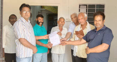 a group of men holding a piece of paper