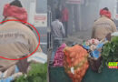 A young man selling vegetables wearing a police jacket in Khurja